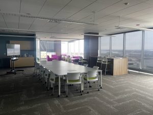A large room with tables and chairs in the middle