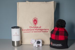 A tote bag, hat, mug and cow toy