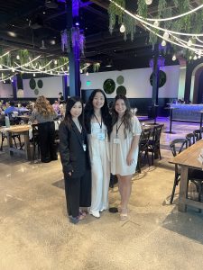 Three Southeast Asian American women stand together