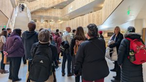 A group of people tour a new building