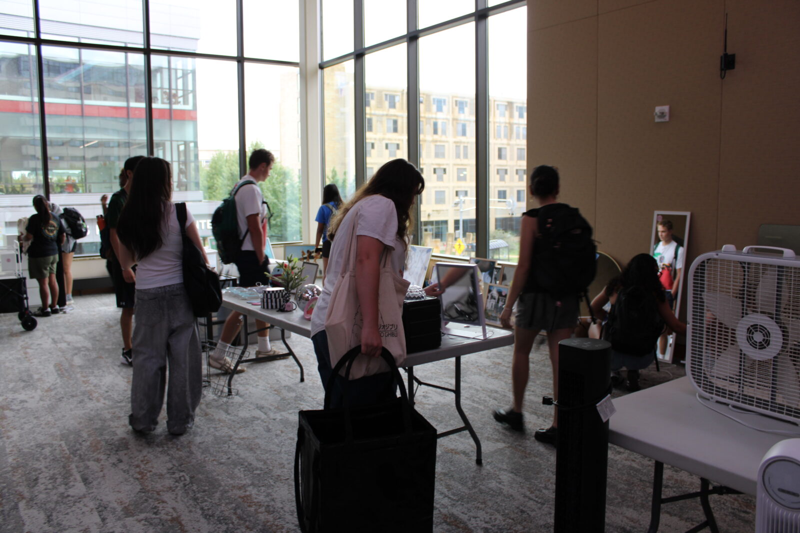 Student surround a table looking at available free items