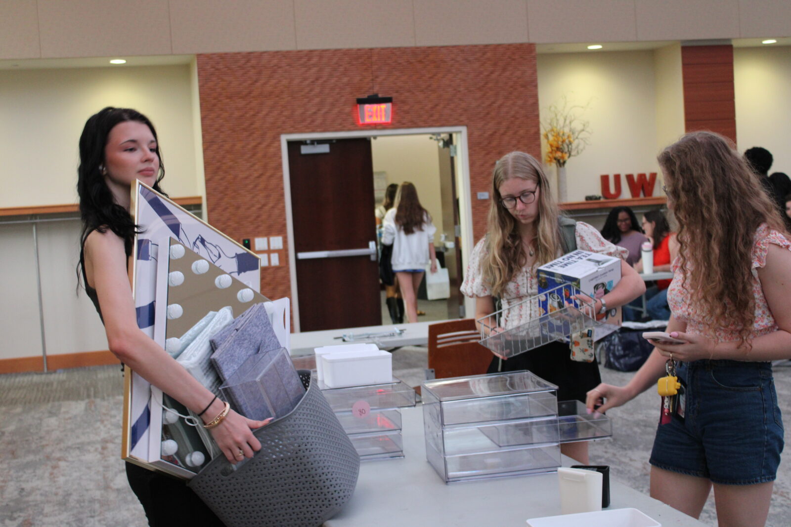 Students fill found containers with other collected items.