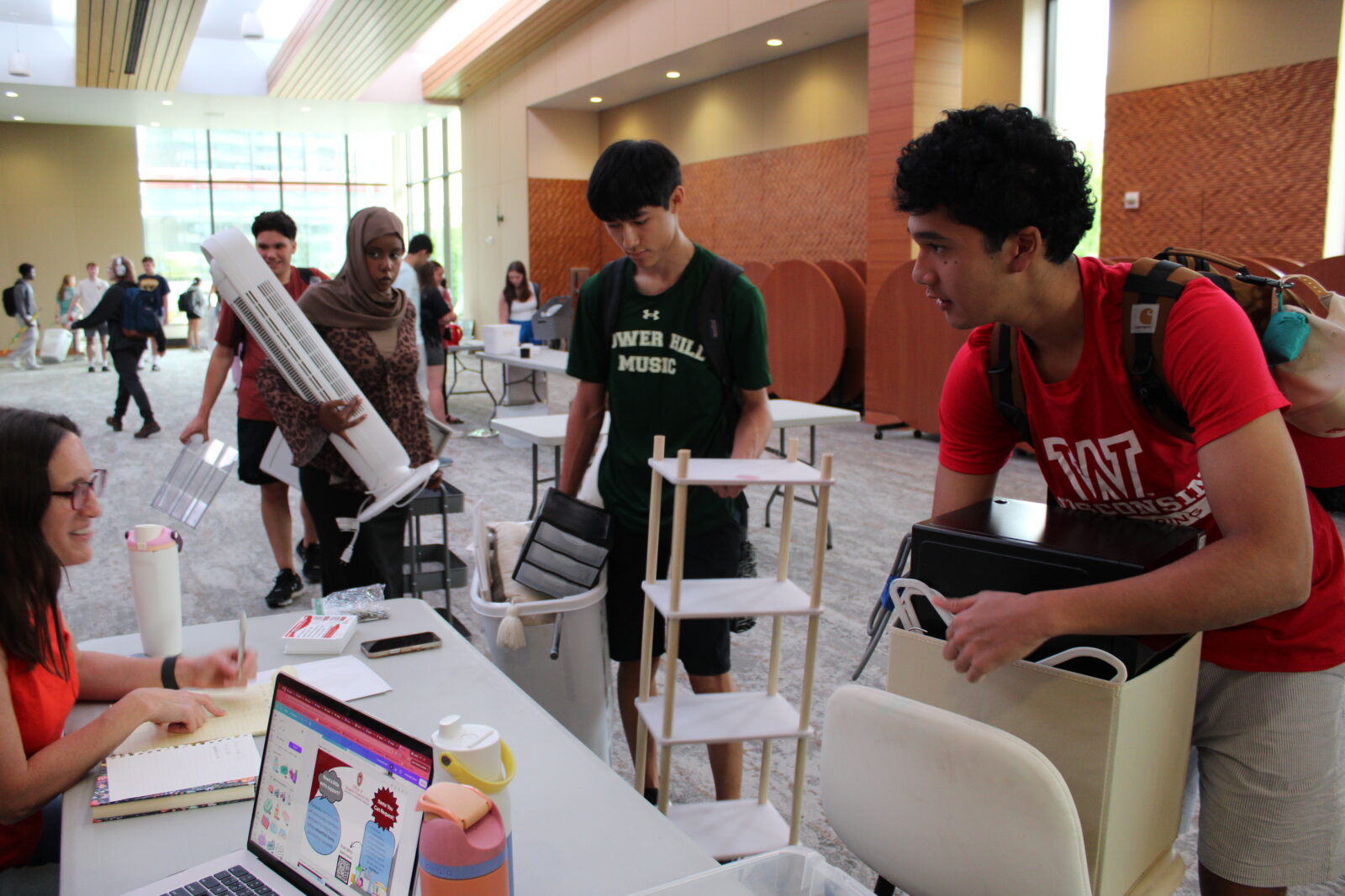 Students line up to check out with their found goods.
