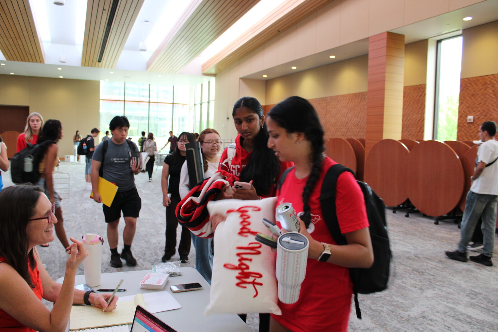 Students line up to check out with their found goods.